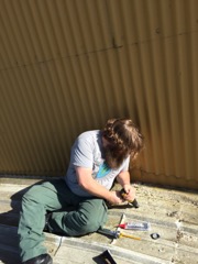 Josh Carpoff, Jeff Rowe working on antena access port. - 1